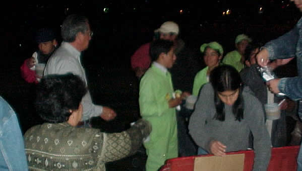 Louis and his youngest daughter, Jessie McBride, feed those who have gathered